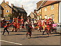 Adderbury High Street with Morris Dancers