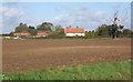 Field with Mere Close Farm beyond