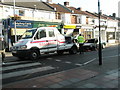 Abandoned car being removed in Highland Road