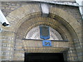 Intriguing detail above door in Lazenby Court