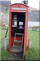 Telephone box complete with chair