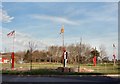 Flagposts at the entrance to the Vale Business Park, Llandow