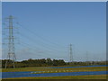 Pylons in a colourful gravel pit near Hoveringham