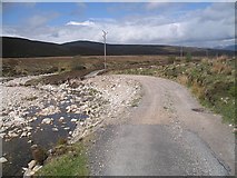 NN7690 : Washed out road, Glen Tromie by Richard Webb