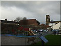 Car park, disused church, town wall and play area