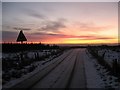 Dawn breaks on the road over Ardrochrig hill