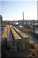 Wooden piles on the quayside