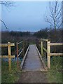 TQ7060 : Footbridge in Leybourne Lakes Country Park by David Anstiss