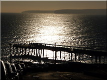 SZ1191 : Boscombe: the pier in silhouette by Chris Downer