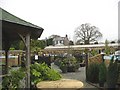 The former Caer Glyddyn Farmhouse viewed across the Garden Centre