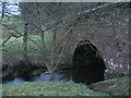 NU1416 : Estate boundary wall bridges stream by ian shiell