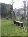 Benches between the church hall and the church at Catherington