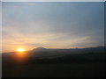 The sun setting over Mynydd Bodafon