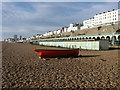 TQ3203 : Boat and Beach Huts by Simon Carey