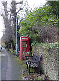 TQ4053 : Seat and Telephone Box, High Street, Limpsfield, Surrey by Christine Matthews