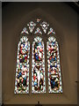 Stained glass window above the altar within Holy Trinity, Duncton