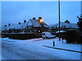 Junction of a snowy Third Avenue and Medina Road