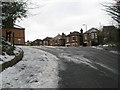 Looking up a steep incline in Wodeland Avenue towards the junction with Mareschal Road