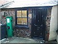 An old hand pump in an alleyway in Thirsk