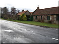 NT8843 : Old roadside cottages by James Denham