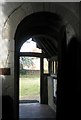 Looking out of the door and into the churchyard at Wisley