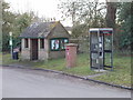 Bus stop, phone, post box, notices in Holton