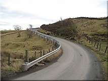 NS9971 : Steep road, Bathgate Hills by Richard Webb