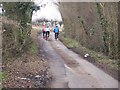 TQ9053 : Cyclists on Flint Lane by David Anstiss