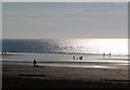 ST1166 : Barry Island: silhouettes enjoying the beach by Chris Downer