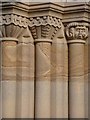 NU2417 : Capitals at the West Door of the Church of St Michael's and All Angels, Howick by Joan Sykes