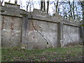 Wall of disused reservoir