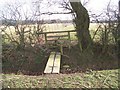 Footbridge and stile on footpath junction