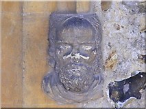 TL7924 : Stone Face at Entrance to All Saints Church by PAUL FARMER