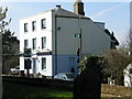 The Blue Pigeons pub from Worth churchyard