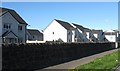 Housing at the side of the A88 at Stenhousemuir