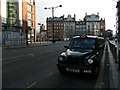 Taxis on Portland Street near the corner with Aytoun Street