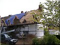 Thatcher at work, Westclyst Farmhouse