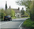 2009 : A360 passing a cottage near Black Dog Farm