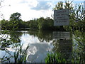 Signs beside Singleton Lake