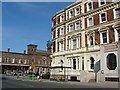 Queen Hotel with railway station in the background