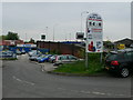 Car sales business beside Wilderspool Bridge