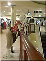 Mannequins survey the escalator, Debenhams, the White Rose Centre