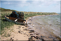 ND4798 : Boat and creels on Glimps Holm by Bob Jones