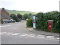 SY3693 : Charmouth: postbox № DT6 70 and phone, Bridge Road by Chris Downer