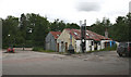 Old workshops by filling station, Newtonmore