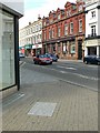 Plaque in the pavement, corner of Silver Street & High Street, Bedford