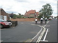 Cyclists crossing the junction of Dukes Road and The Crossways