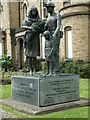 A Statue of a Miner and his Family