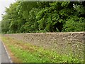 Cotswold stone wall alongside the A433 near Dunkirk