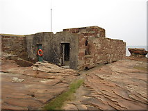 SJ1888 : Old lifeboat house on Hilbre and rock by John S Turner